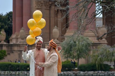 Gay couple getting married at Palace of Fine Arts Theatre in San