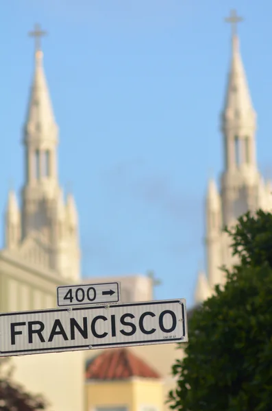 Francisco street sign against the bells towers — Stock Photo, Image