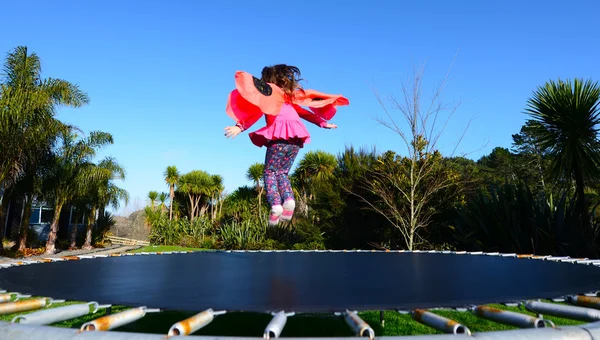 Happy little child dressed up as lady bug buns and jumps on tram — Stock Photo, Image