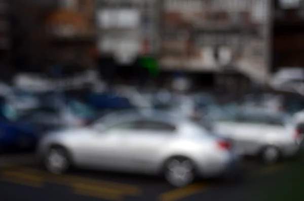 Bokeh bakgrund av bilar på en parkering lo — Stockfoto