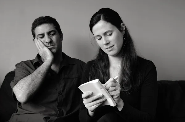 Worried couple listing expenses — Stock Photo, Image