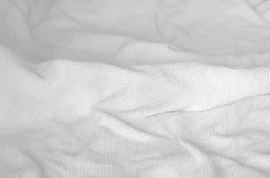 White blanket on bed in the bedroom