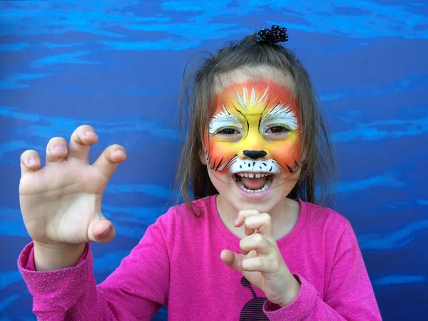 Little child with lion face painting — Stock Photo, Image