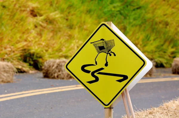 Dangerous slippery road sign of shopping trolley on the roadside — Stock Photo, Image