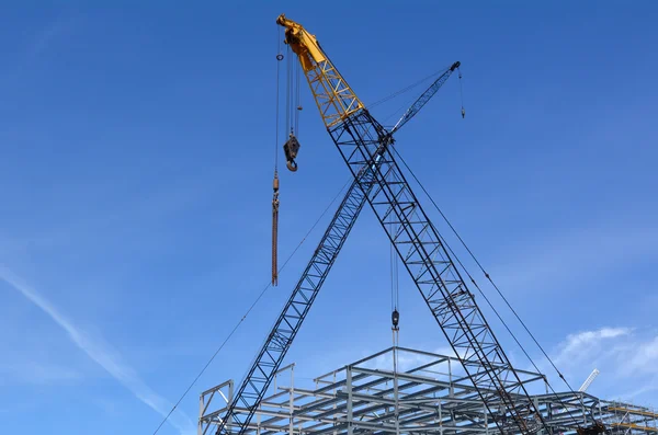Cranes in construction site — Stock Photo, Image