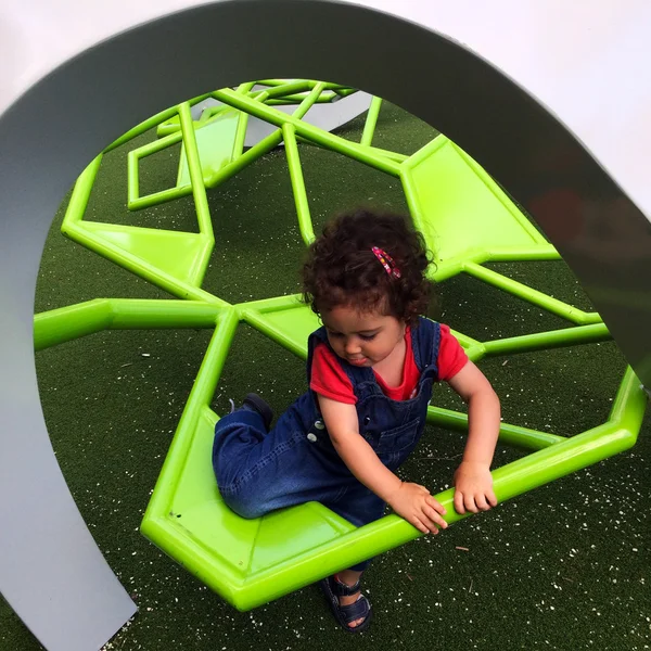 Child crossing obstacles in the playground — Stok fotoğraf