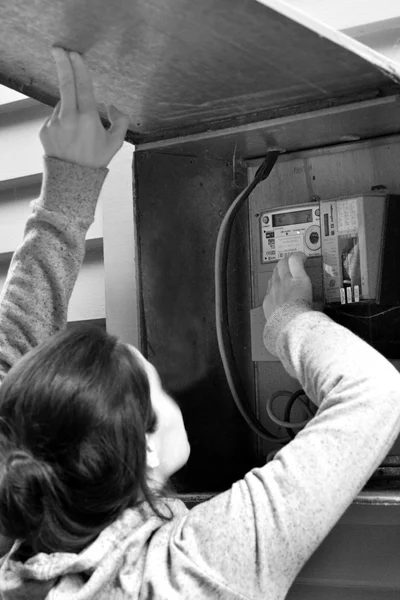 Woman check her smart meter — Stok fotoğraf