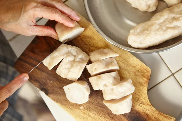 Cutting fish cake — Stock Photo, Image