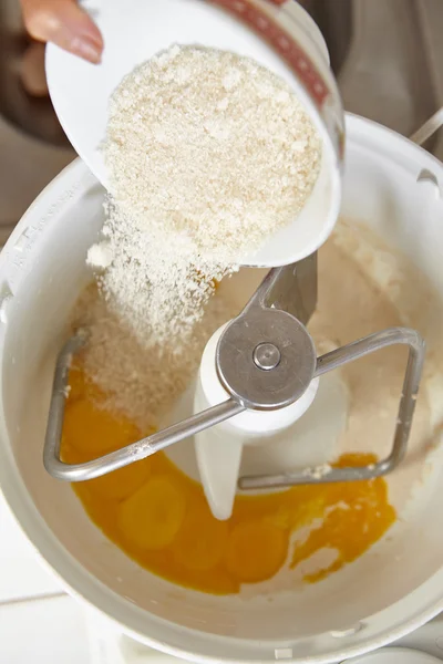 Adding ingredient to batter machine — Stock Photo, Image