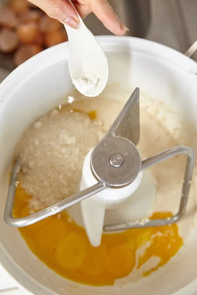 Adding ingredient to batter machine — Stock Photo, Image