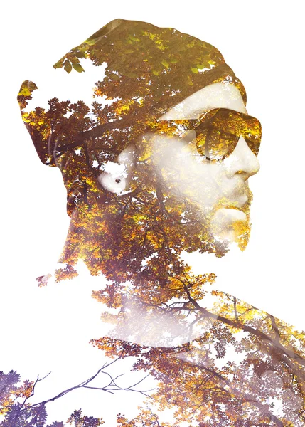 Портрет чоловіка з подвійною експозицією в поєднанні з гілками і деревами Ліцензійні Стокові Фото