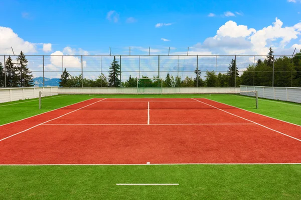 Synthetic outdoor tennis court Royalty Free Stock Photos