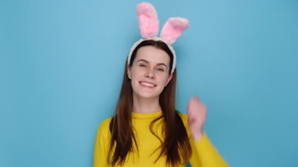 Positive Young Caucasian Female Pink Bunny Fluffy Ears Pleased Showing — Stock Video