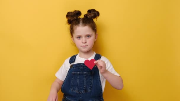 Portrait Positive Little Sincere Adorable Girl Holding Red Heart Chest — Stock Video
