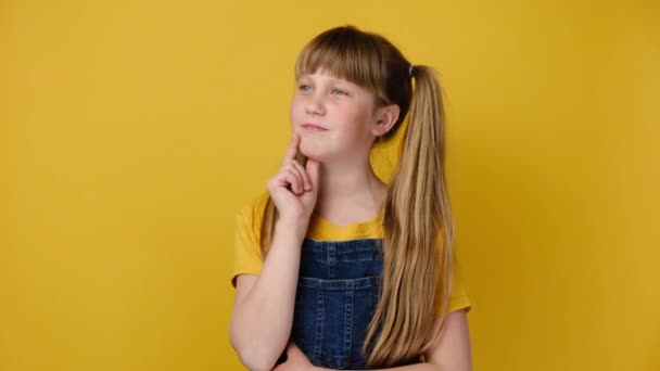 Serious Little Girl Kid Smirk Face Ponders Decision Isolated Yellow — Stock Video