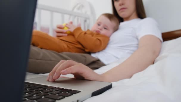 Selective Focus Young Business Mother Using Laptop Sit Bed Home — Stock Video