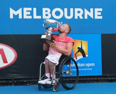 Grand Slam champion Dylan Alcott of Australia posing with trophy after Australian Open 2016 quad wheelchair singles final