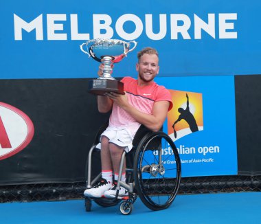Grand Slam champion Dylan Alcott of Australia posing with trophy after Australian Open 2016 quad wheelchair singles final