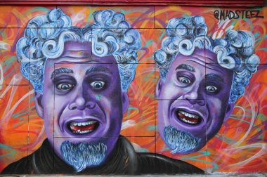 Mural art by artist  Mark Paul Deren, more commonly known as MADSTEEZ, in Little Italy in Manhattan