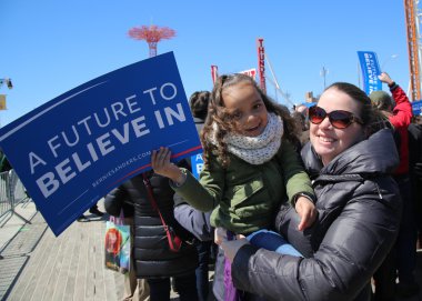 Young Bernie Sanders supporter during presidential candidate Bernie Sanders rally  at iconic Coney Island boardwalk clipart