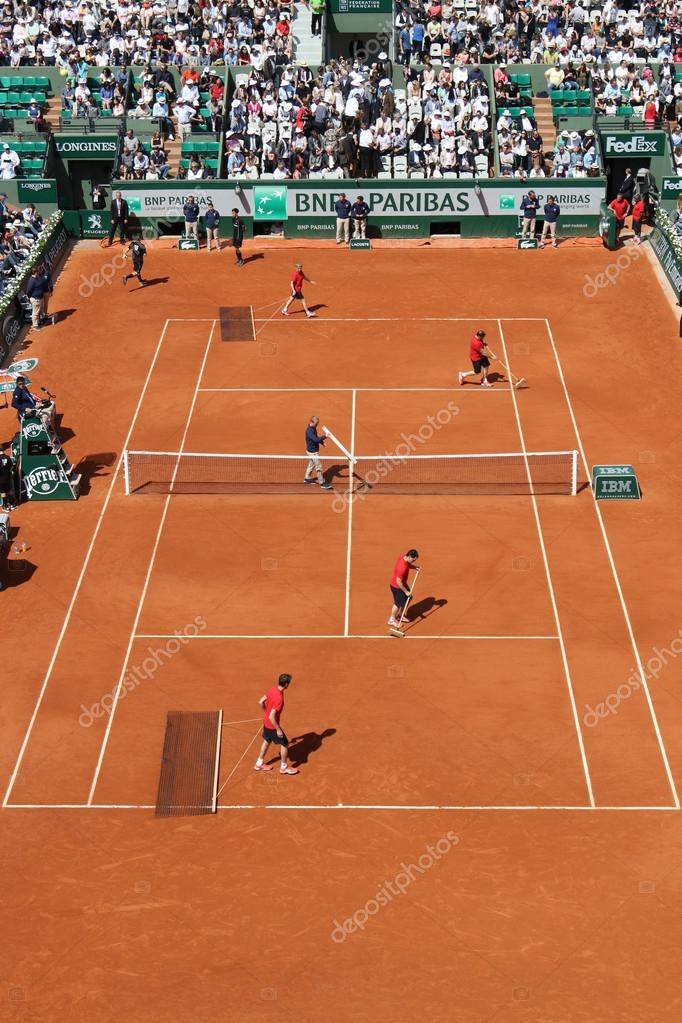 PARIS, FRANCE- MAY 29, 2015: Court Philippe Chatrier preparation and maintenance team  at Le Stade Roland Garros during Roland Garros 2015 match in Paris, France
