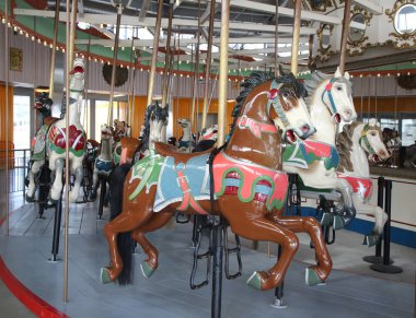 Horses on a traditional fairground B&B carousel at historic Coney Island Boardwalk