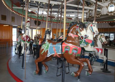Horses on a traditional fairground B&B carousel at historic Coney Island Boardwalk