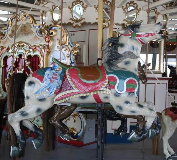 Horses on a traditional fairground B&B carousel at historic Coney Island Boardwalk — Stockfoto