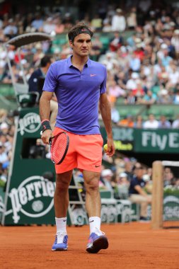 Seventeen times Grand Slam champion Roger Federer during his first round match at Roland Garros 2015  clipart
