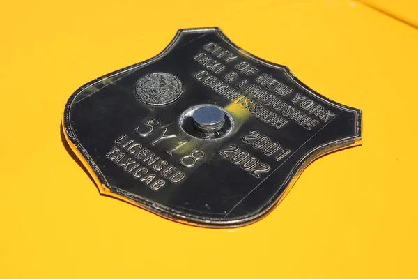 Vintage New York City taxi medallion — Stock Photo, Image