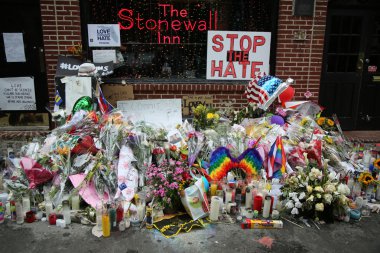 Memorial outside the gay rights landmark Stonewall Inn for the victims of the mass shooting in Pulse Club, Orlando clipart