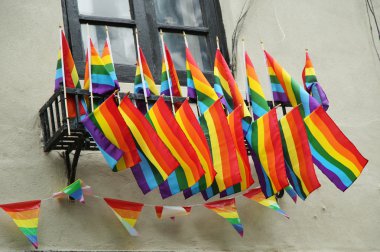 Rainbow flags outside the gay rights landmark Stonewall Inn  in New York City clipart