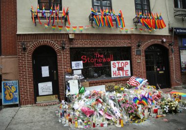 Memorial outside the gay rights landmark Stonewall Inn for the victims of the mass shooting in Pulse Club, Orlando clipart