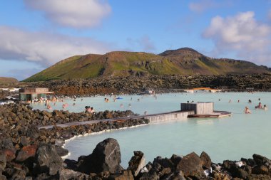 Visitors enjoying famous Blue Lagoon Geothermal Spa in Iceland clipart