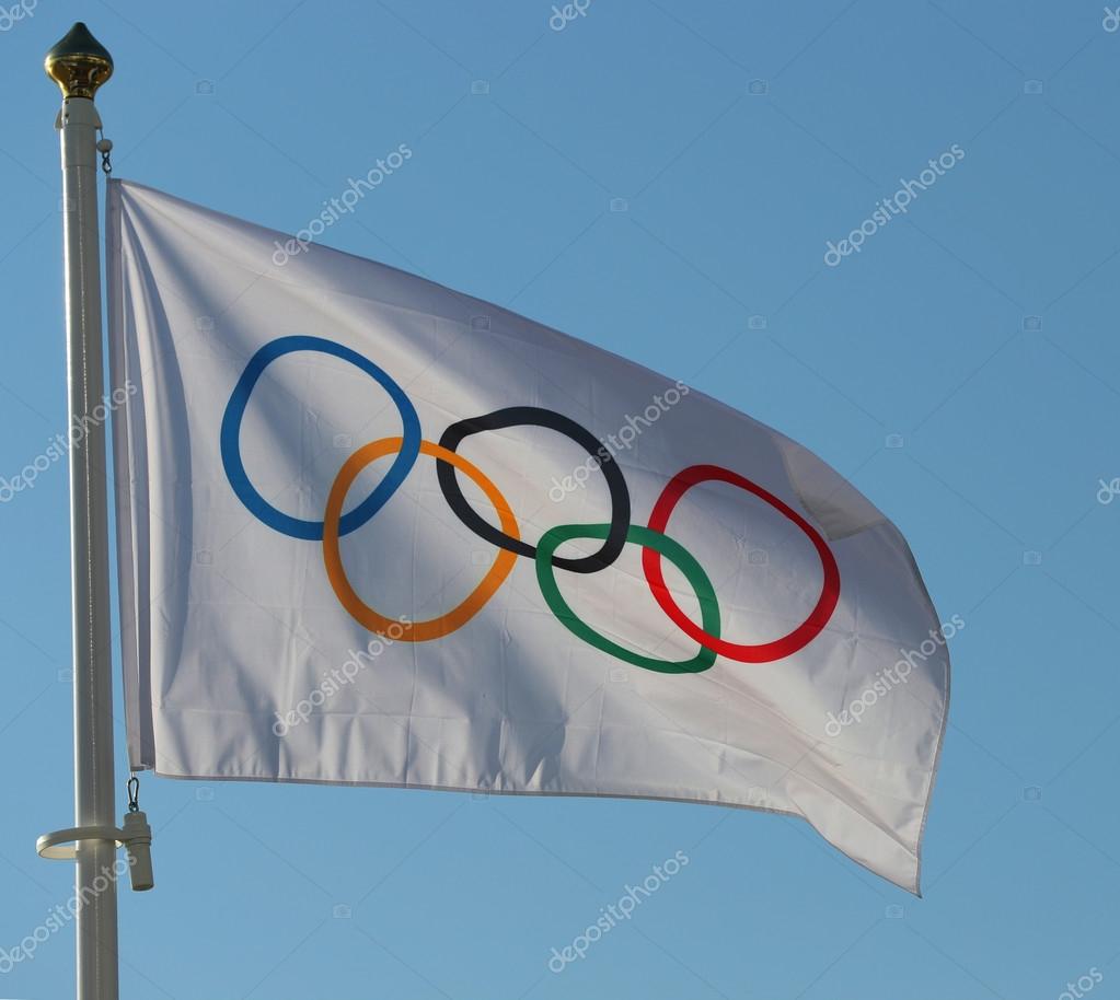 RIO DE JANEIRO, BRAZIL AUGUST 6, 2016: Olympic Flag at Copacabana Beach in Rio de Janeiro