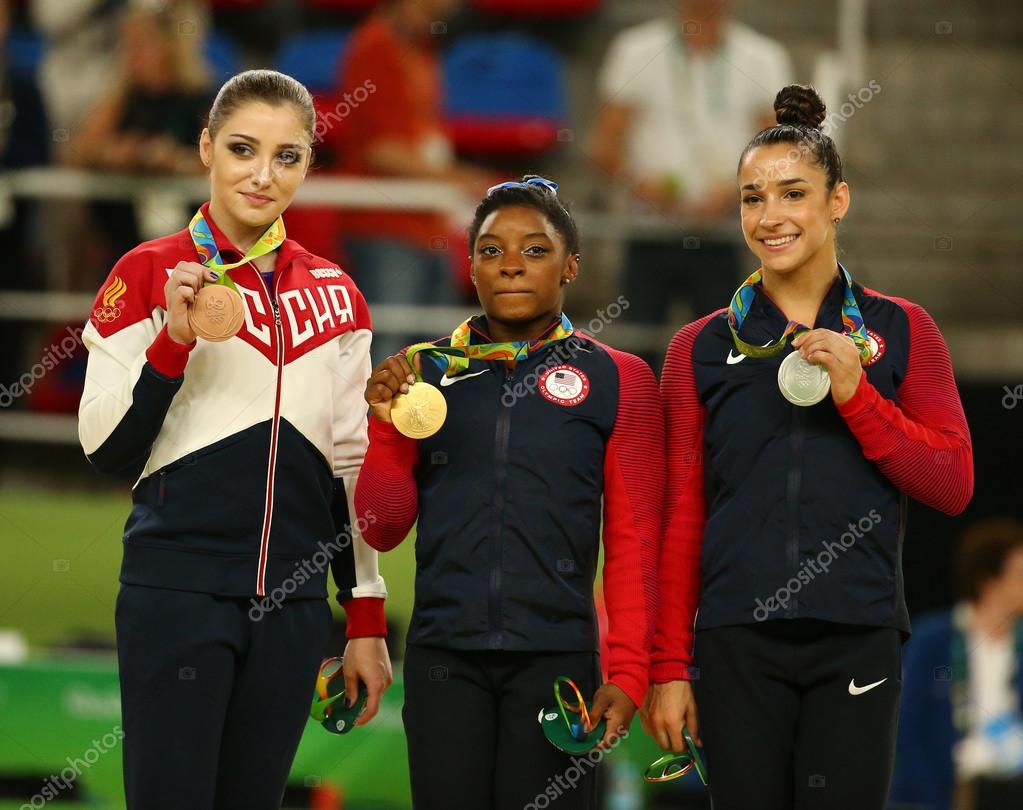 RIO DE JANEIRO, BRAZIL - AUGUST 11, 2016:Women's all-around gymnastics winners at Rio 2016 Olympic Games Aliya Mustafina of Russia (L), Simone Biles of USA and Aly Raisman of USA during medal ceremony