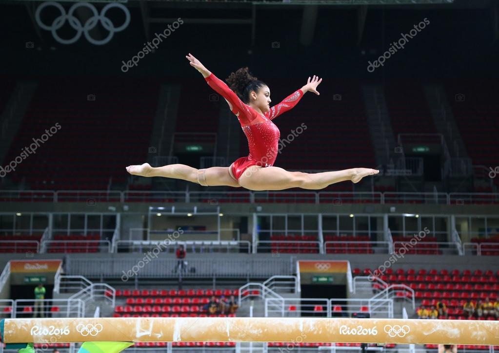 RIO DE JANEIRO, BRAZIL - AUGUST 4, 2016: Olympic champion Laurie Hernandez of United States practices on the balance beam before women's all-around gymnastics at Rio 2016 Olympic Games
