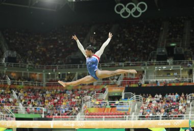 Olympic champion Simone Biles of United States competing on the balance beam at women's all-around gymnastics at Rio 2016  clipart