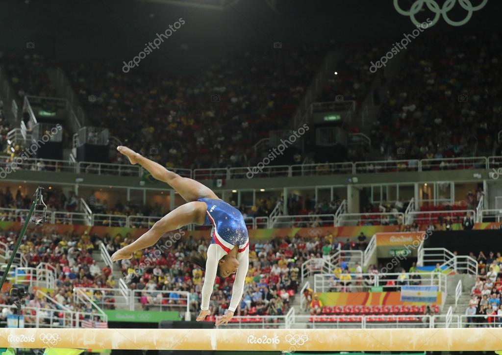 RIO DE JANEIRO, BRAZIL - AUGUST 11, 2016: Olympic champion Simone Biles of United States competing on the balance beam at women's all-around gymnastics at Rio 2016 Olympic Games