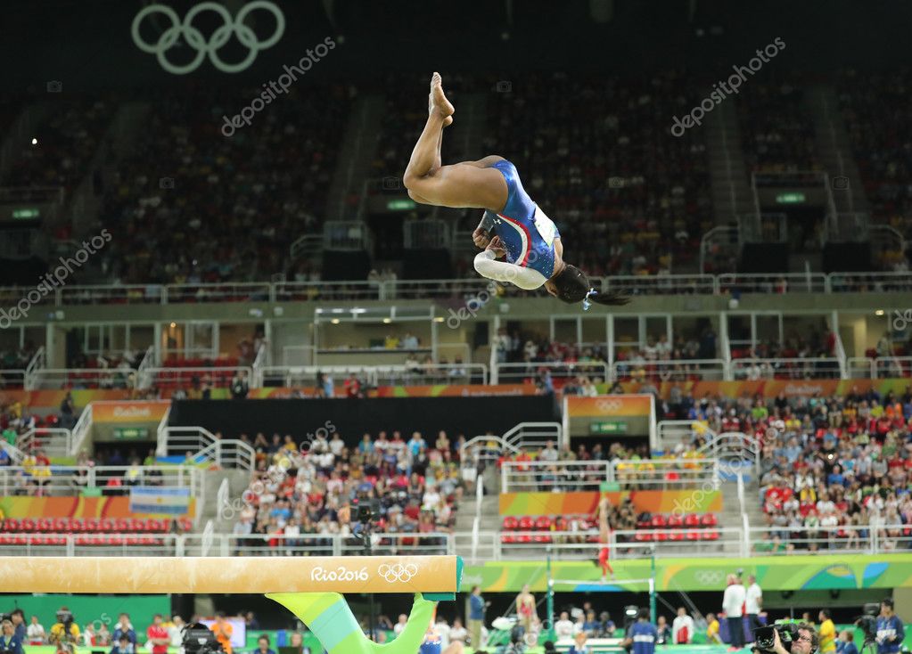 RIO DE JANEIRO, BRAZIL - AUGUST 11, 2016: Olympic champion Simone Biles of United States competing on the balance beam at women's all-around gymnastics at Rio 2016 Olympic Games