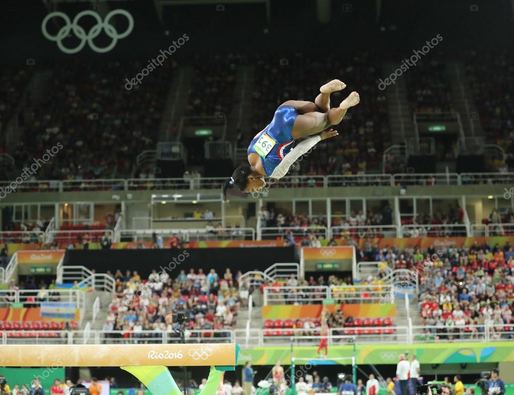 RIO DE JANEIRO, BRAZIL - AUGUST 11, 2016: Olympic champion Simone Biles of United States competing on the balance beam at women's all-around gymnastics at Rio 2016 Olympic Games