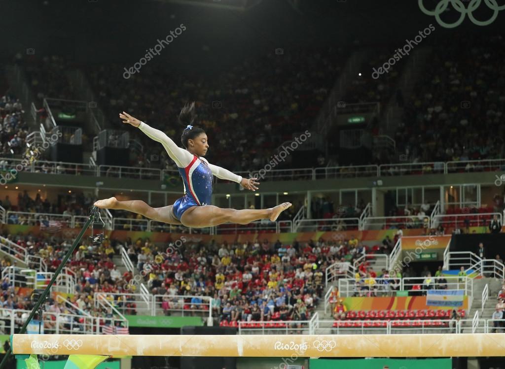 RIO DE JANEIRO, BRAZIL - AUGUST 11, 2016: Olympic champion Simone Biles of United States competing on the balance beam at women's all-around gymnastics at Rio 2016 Olympic Games