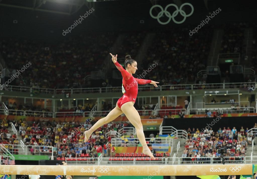 RIO DE JANEIRO, BRAZIL - AUGUST 11, 2016: Olympic champion Aly Raisman of United States competing on the balance beam at women's all-around gymnastics at Rio 2016 Olympic Games