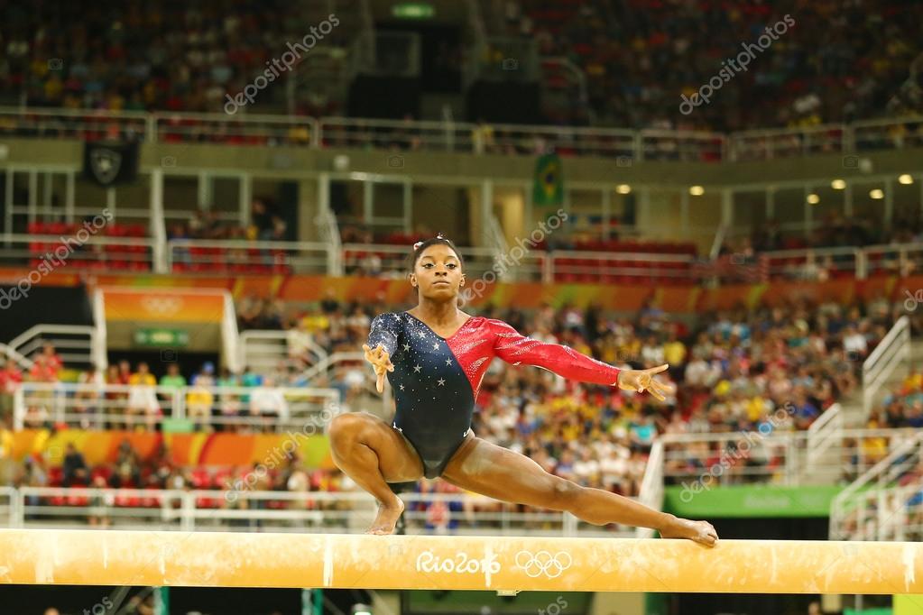 RIO DE JANEIRO, BRAZIL AUGUST 7, 2016: Olympic champion Simone Biles of United States competing on the balance beam at women's all-around gymnastics qualification at Rio 2016 Olympic Games