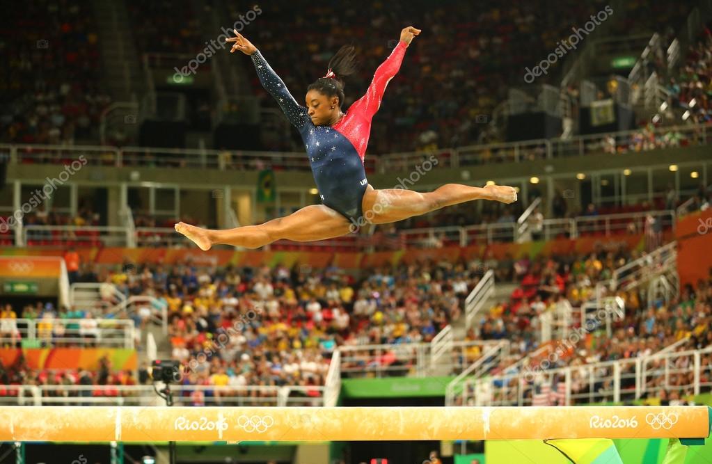 RIO DE JANEIRO, BRAZIL AUGUST 7, 2016: Olympic champion Simone Biles of United States competing on the balance beam at women's all-around gymnastics qualification at Rio 2016 Olympic Games