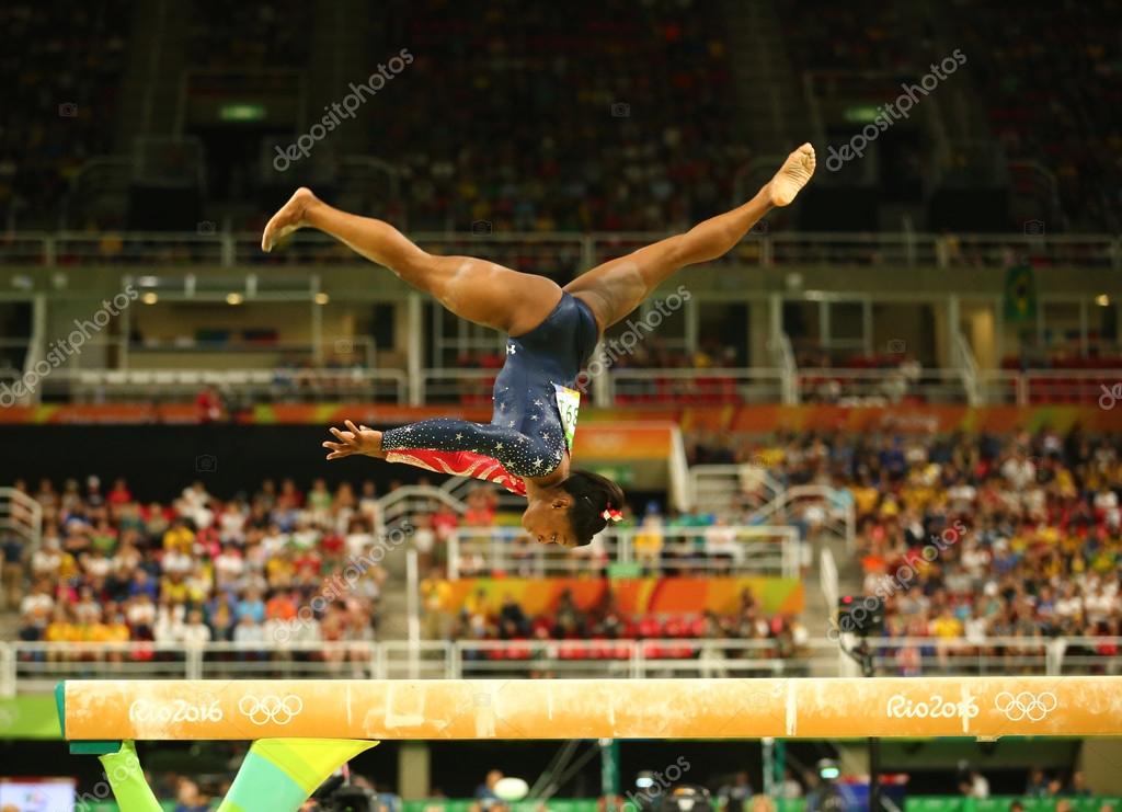 RIO DE JANEIRO, BRAZIL AUGUST 7, 2016: Olympic champion Simone Biles of United States competing on the balance beam at women's all-around gymnastics qualification at Rio 2016 Olympic Games