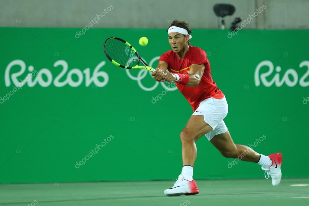 RIO DE JANEIRO, BRAZIL - AUGUST 12, 2016: Olympic champion Rafael Nadal of Spain in action during men's doubles final of the Rio 2016 Olympic Games at the Olympic Tennis Centre
