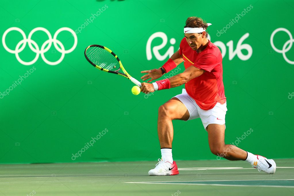 RIO DE JANEIRO, BRAZIL - AUGUST 12, 2016: Olympic champion Rafael Nadal of Spain in action during men's singles semifinal of the Rio 2016 Olympic Games at the Olympic Tennis Centre