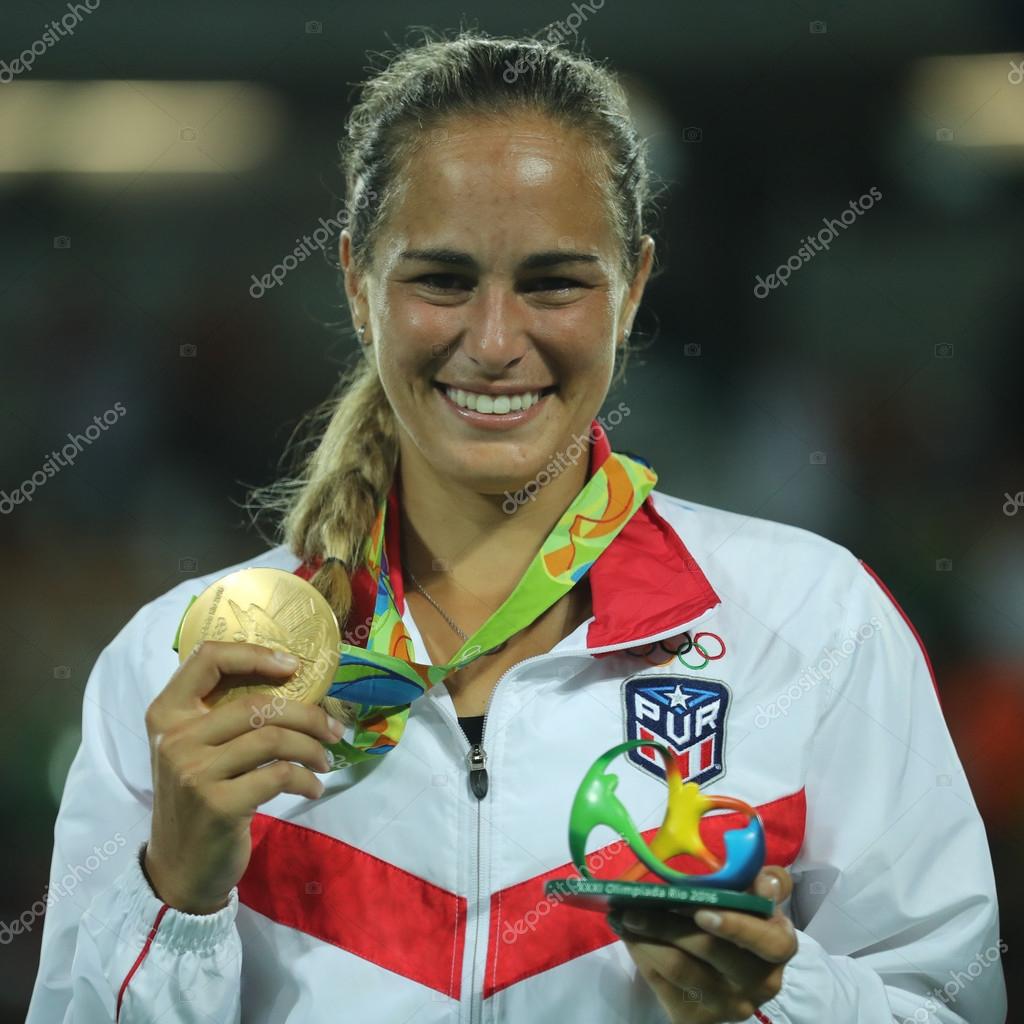 RIO DE JANEIRO, BRAZIL - AUGUST 13, 2016: Olympic champion Monica Puig of Puerto Rico during medal ceremony after victory at women's singles final of the Rio 2016 Olympic Games