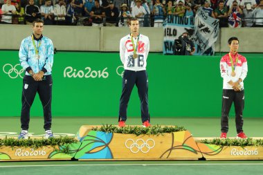 Juan Martin Del Porto ARG (L), Olympic champion Andy Murray GBR and Kei Nishikori JPN during tennis men's singles medal ceremony clipart